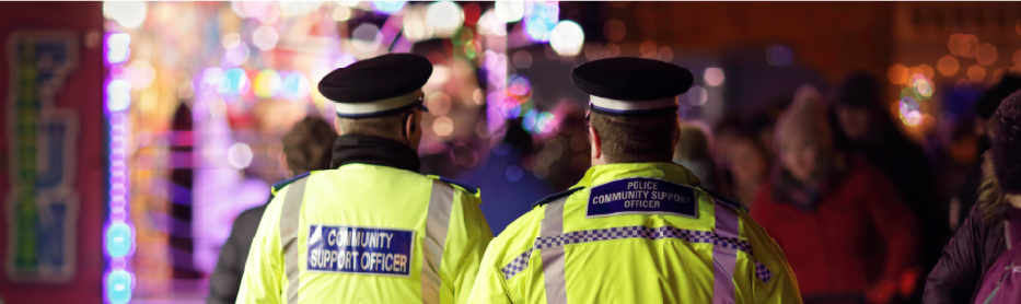 Community support officers keep the public safe at an evening city event